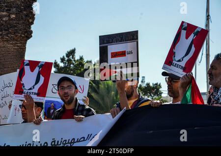 November 2, 2023: Tunis, Tunisia. 02 November 2023. Protesters waive the Palestinian flag and chant slogans in support of Palestinians and against the Israeli military offensive in Gaza outside the Parliament building in Tunis. The demonstration coincided with an extraordinary session by the Tunisian parliament discussing a draft law criminalising the normalisation of relations with Israel. If approved, the draft law would criminalise economic, cultural, and military ties with Israel (Credit Image: © Hasan Mrad/IMAGESLIVE via ZUMA Press Wire) EDITORIAL USAGE ONLY! Not for Commercial USAGE! Stock Photo