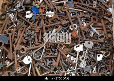 Castelnuovo don Bosco, Piedmont, Italy -04-25-2022- Texture in flat lay angle of old and rusty keys at the antiques market Stock Photo