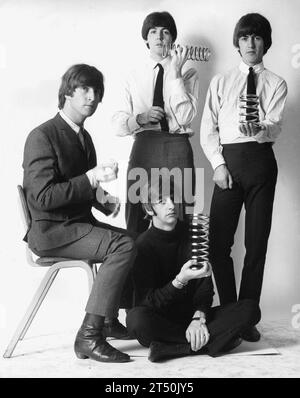 August 9, 1965, New York, New York, USA; The 'fab 4' English rock band The Beatles' JOHN LENNON, GEORGE HARRISON, RINGO STARR and PAUL MCCARTNEY clowning around large steel springs in the studio during a portrait shoot. (Credit Image: © Keystone Press Agency/ZUMA Press Wire) EDITORIAL USAGE ONLY! Not for Commercial USAGE! Stock Photo