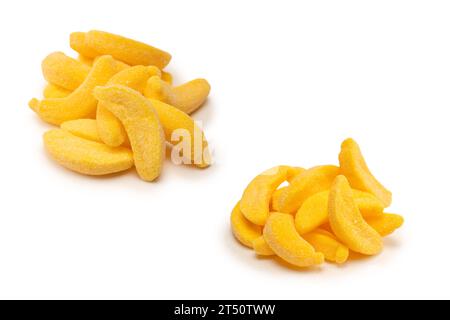 Juicy colorful jelly banana sweets isolated on white. Gummy candies. Stock Photo