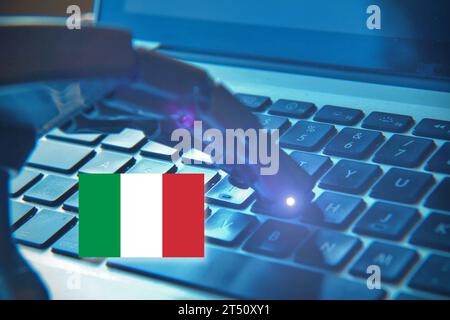 Robotic hand typing on a keyboard and the Italian Flag. Concept of future and AI in Italy . Stock Photo