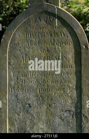 19th century headstone at Le Vieux Cimetière, old cemetery along the Semois river in the village Mortehan, Bertrix, Luxembourg, Ardennes, Belgium Stock Photo