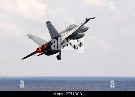 1002123327M-090 SOUTH CHINA SEA (Feb. 12, 2010) An F/A-18C Hornet assigned to the Sidewinders of Strike Fighter Squadron (VFA) 86, launches from the aircraft carrier USS Nimitz (CVN 68). The Nimitz Carrier Strike Group is supporting maritime security operations in the U.S. 7th Fleet area of responsibility. Navy Stock Photo