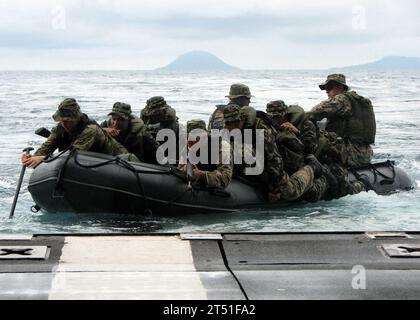 0706057058E-005  SOUTH CHINA SEA (June 5, 2007) - U.S. and Philippine Marines guide their assault boat to sea after departing from the stern ramp of dock landing ship USS Harpers Ferry (LSD 49) during an amphibious assault exercise near Pilas Island, Philippines. The Philippine Marine Corps is training with the 3rd Marine Expeditionary Force's Special Operations Training Group (SOTG) during the 1st phase of the 13th annual Cooperation Afloat Readiness and Training (CARAT) exercise series. CARAT is an annual series of bilateral maritime training exercises between the U.S. and six Southeast Asia Stock Photo