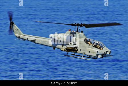 0906095345W-008  MEDITERRANEAN SEA (June 9, 2009) An AH-1W Super Cobra from the Thunder Chickens of Marine Medium Tiltrotor Squadron (VMM) 263 performs a low-altitude surveillance pass during a Visit, Board, Search and Seizure (VBSS) drill aboard the amphibious dock landing ship USS Fort McHenry (LSD 43). The Fort McHenry is deployed with the Bataan Amphibious Ready Group (ARG) in support of maritime security operations in the 5th and 6th Fleet areas of responsibility. Navy Stock Photo