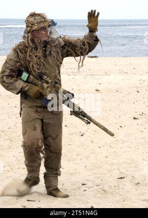 1007170683T-292 VIRGINIA BEACH, Va. (July 17, 2010) A U.S. Navy SEAL sniper waves to the crowd during a capabilities demonstration at Joint Expeditionary Base Little Creek, Va. The Naval Special Warfare community event was part of the 41st UDT/SEAL East Coast Reunion celebration. Navy Stock Photo