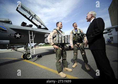 1004225549O-044 PATUXENT RIVER, Md. (April 22, 2010) Secretary of the Navy (SECNAV) the Honorable Ray Mabus greets Navy pilots Cdr. Beau Duarte and Lcdr. Tom Weaver following a showcase of a supersonic flight test of the 'Green Hornet,' conducted at Naval Air Station Patuxent River, Md. The F/A-18 Super Hornet strike fighter jet is powered by a 50/50 biofuel blend. Navy Stock Photo