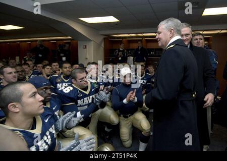 0712018273J-230 BALTIMORE (Dec. 1, 2007) Р In the locker room, Chief of Naval Operations (CNO) Adm. Gary Roughead congratulates the U.S. Naval Academy team following a 38-3 victory over the Black Knights of the Army.  The 108th Army-Navy football game was held at M&T Bank Stadium. The Navy has accepted an invitation to play in the Poinsettia Bowl in San Diego on Dec. 20. U.S. Navy Stock Photo