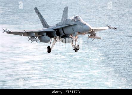 9802068982D-003 At sea aboard USS George Washington (CVN 73) in the Arabian Gulf (Feb. 6, 1998) -- An F/A-18C “Hornet” assigned to Marine Fighter Attack Squadron (VMFA) 251, makes its final approach after returning from a mission in the Gulf region.  The aircraft is loaded with AIM-9 “Sidewinder” short-range air-to-air missiles mounted on each wing tip, and under each wing are AGM-88 “HARM” air-to-ground high-speed missiles. The AGM-88 HARM (high-speed antiradiation missile) is an air-to-surface tactical missile designed to seek and destroy enemy radar-equipped air defense systems. George Wash Stock Photo