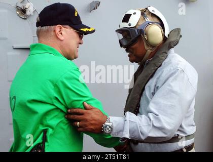 0807289116H-003  ATLANTIC OCEAN (July 27, 2008) Capt. Ladd Wheeler, commanding officer of the aircraft carrier USS Theodore Roosevelt, left, welcomes aboard Assistant Secretary of the Navy  Mr. B.J. Penn. The Theodore Roosevelt Carrier Strike Group is participating in Joint Task Force Exercise 'Operation Brimstone' off the U.S. East Coast. Navy Stock Photo