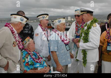 0612079076B-175 Pearl Harbor, Hawaii (Dec. 7, 2006) - Commander U.S. Pacific Fleet Adm. Gary Roughead talks with Pearl Harbor survivors after taking part in the joint U.S. Navy/National Park Service ceremony commemorating the 65th Anniversary of the attack on Pearl Harbor. More than 1,500 Pearl Harbor survivors, their families and friends from around the nation along with 2,000 distinguished guests and the general public took part in this annual observance. U.S. Navy Stock Photo