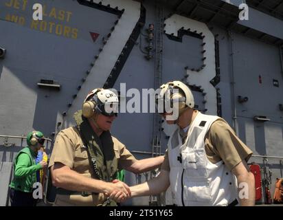 0908198273J-356 PACIFIC OCEAN (Aug. 19, 2009) Chief of Naval Operations (CNO) Adm. Gary Roughead, left, thanks Capt. David Lausman, commanding officer of the Nimitz-class aircraft carrier USS George Washington (CVN 73), after visiting with Sailors aboard the ship. While in Indonesia, Roughead visited George Washington and attended the International Maritime Seminar and Indonesian International Fleet Review. Navy Stock Photo