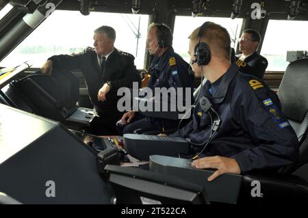 1008198273J-085  KARLSKRONA, Sweden (Aug. 19, 2010) On the bridge, Chief of Naval Operations (CNO) Adm. Gary Roughead, left, looks on as the crew members of the Visby Corvette HSwMS NYKOPING  get underway from Naval Base Karlskrona Naval Base.  Navy Stock Photo