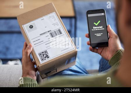 Box label, phone screen and person hands reading security verification check, safety scan or track online shopping order. Tick, mail shipping and home Stock Photo