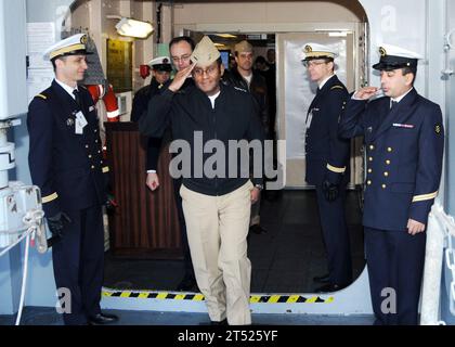 0901292248M-046 NORFOLK (Jan. 29) French sailors aboard the French Navy amphibious assault helicopter carrier FS Tonnerre (L9014) render honors as Vice Adm. Mel Williams Jr., commander of U.S. 2nd Fleet, departs the ship. Tonnerre is conducting a port visit to Naval Station Norfolk as she prepares to participate in the Bataan Composite Training Unit Exercise (COMPTUEX). Navy Stock Photo