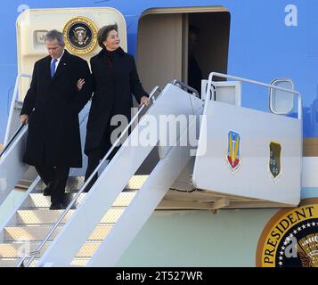 0901105345W-059 NORFOLK (Jan. 10, 2009) President George W. Bush and his wife, first lady Laura Bush, disembark from Air Force One shortly after arriving at Naval Station Norfolk. President Bush and several members of his administration arrived in Norfolk to attend the commissioning of the aircraft carrier USS George H. W. Bush (CVN 77). The trip itself was also historic as it served as Bush's final scheduled flight aboard Air Force One. Navy Stock Photo