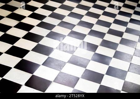 Floor tiles-mosaic background, interior design. The black and white tiles of the stone floor are staggered. Tile cladding for bath, kitchen hallway, i Stock Photo