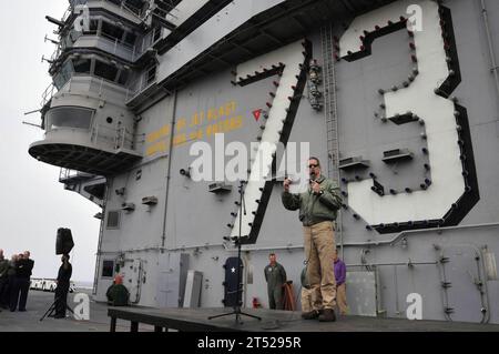 110419VL413-143 PACIFIC OCEAN (April 19, 2011) Capt. David Lausman, commanding officer of the aircraft carrier USS George Washington (CVN 73) addresses the crew during an all-hands call on the flight deck. George Washington departed Commander, Fleet Activities Yokosuka on March 21, 2011 in response to the complex nature of the earthquake and subsequent tsunami that struck Japan. The forward-deployed aircraft carrier is scheduled to remain in the waters off Japan. Navy Stock Photo