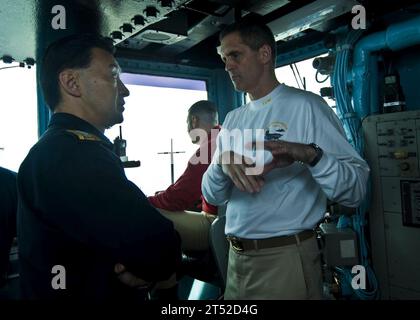 1006244830B-082 PACIFIC OCEAN (June 24, 2010) Capt. David Lausman, commanding officer of the aircraft carrier USS George Washington (CVN 73), explains emergency breakaway procedures to Japan Maritime Self-Defense Force Rear Adm. Umio Otsuka, commander of Escort Flotilla 2, during a replenishment at sea with the Military Sealift Command fleet replenishment oiler USNS Tippecanoe (T-AO-199). George Washington, the Navy's only permanently forward-deployed aircraft carrier, is participating in Undersea Warfare Exercise (USWEX), an annual bilateral exercise involving the Japan Maritime Self-Defense Stock Photo