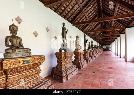 Pha That Luang, That Luang, Buddha statues at corridor, Buddhist stupa and temple, Vientiane, Laos, Southeast Asia, Asia Stock Photo