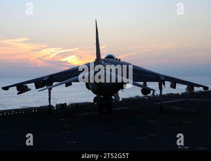 0912142735T-159 ATLANTIC OCEAN (Dec. 14, 2009) An AV-8B Harrier II jet maneuvers around the flight deck of the amphibious assault ship USS Nassau (LHA 4). Nassau is underway with other elements of the Nassau Amphibious Ready Group and the embarked 24th Marine Expeditionary Unit (24th MEU) for a certification exercise. Navy Stock Photo