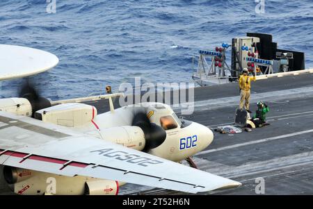 An E-2C Hawkeye prepares to take off from the flight deck of USS Dwight ...