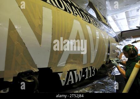 aircraft, HANGAR BAY, painting, Sailor, U.S. Navy, USS Ronald Reagan (CVN 76) Stock Photo