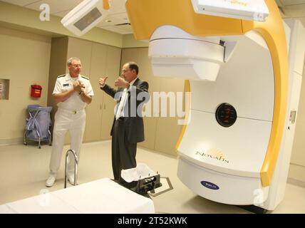 1009103271W-092 SALT LAKE CITY (Sept. 9, 2010) Vice Adm. Kevin M. McCoy, commander of Naval Sea Systems Command, listens to Ray Lynch, Executive Director of the University Healthcare center at the University of Utah during Salt Lake City Navy Week, one of 19 Navy Weeks planned across America in 2010. Navy Weeks are designed to show Americans the investment they have made in their Navy and increase awareness in cities that do not have a significant Navy presence. Navy Stock Photo