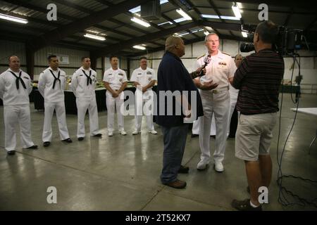 1009103271W-016 SALT LAKE CITY (Sept. 9, 2010) Vice Adm. Kevin M. McCoy, commander of Naval Sea Systems Command, is interviewed by FOX 13 television at the Utah State Fair during Salt Lake City Navy Week, one of 19 Navy Weeks planned across America in 2010. Navy Weeks are designed to show Americans the investment they have made in their Navy and increase awareness in cities that do not have a significant Navy presence. Navy Stock Photo