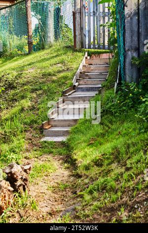 Wooden old stairs at natural panoramic countryside at sunny day Stock Photo