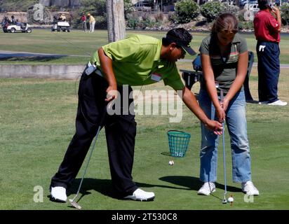 0707189604C-009 CHULA VISTA, Calif. (July 18, 2007) - Golf professional Pat Diaz gives a young golfer a few pointers on putting at the Chula Vista Municipal Golf Course. Pin Pals Junior Links, a non-profit organization, has established a partnership with Armed Services YMCA of San Diego and provides free beginner junior golf lessons for boys and girls, ages 10 to 13, whose parent(s) are serving the country. Each session is conducted by a PGA professional and will meet once a week for two, four-week sessions and will cover the basics of putting, chipping, pitching and the full swing. U.S. Navy Stock Photo