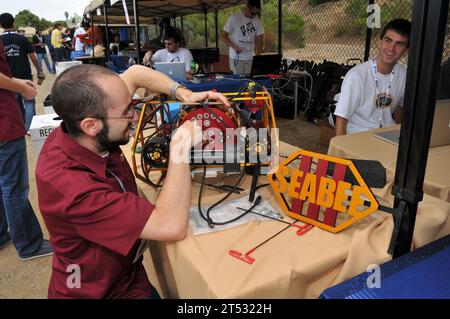 110713UN340-029 SAN DIEGO (July 13, 2011) Noah Olsman, a University of Southern California student, prepares his teamХs autonomous underwater vehicle (AUV), SeaBee III, for a practice run during the 14th annual International RoboSub Competition at Space and Naval Warfare Systems Center Pacific. The competition, co-sponsored by the Office of Naval Research and the Association for Unmanned Vehicle Systems International (AUVSI), challenges teams of student engineers to design AUVs to perform realistic missions in a simulated ocean environment. (U.S. Navy Stock Photo