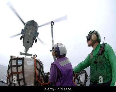 0709230194K-036  ATLANTIC OCEAN (Sept. 23, 2007) - Two Sailors prepare to secure cargo to an MH-60S Seahawk, attached to Helicopter Sea Combat Squadron (HS) 28, to support a Military Sealift Command hospital ship USNS Comfort (T-AH 20) humanitarian mission in Guyana. Comfort is on a four-month humanitarian deployment to Latin America and the Caribbean providing medical treatment to patients in a dozen countries. U.S. Navy Stock Photo