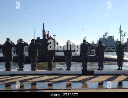 1101217179M-038 NORFOLK (Jan. 21, 2011) The Los Angeles-class attack submarine USS Scranton (SSN 756) departs Naval Station Norfolk for a scheduled six-month deployment as Sailors assigned to the Los Angeles-class attack submarine USS Boise (SSN 764) render a final salute. Scranton is deploying to the U.S. European Command area of responsibility where it will execute the Chief of Naval Operation Maritime Strategy in supporting national security interests and maritime security operations. Stock Photo