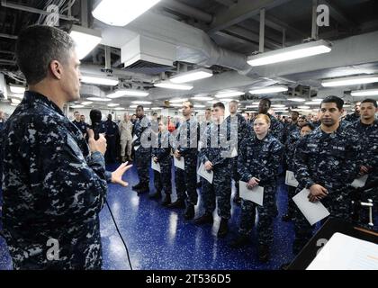 110604EC658-080 MEDITERRANEAN SEA (June 4, 2011) Capt. Stephen Koehler, commanding officer of the multipurpose amphibious assault ship USS Bataan (LHD 5), addresses newly promoted Sailors during a frocking ceremony on the shipХs mess decks. Bataan is the command ship of the Bataan Amphibious Ready Group supporting maritime security operations and theater security cooperation efforts in the U.S. 6th Fleet area of responsibility. Stock Photo