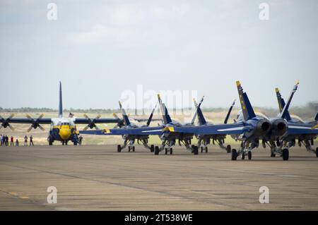 110324RY232-008 MERIDIAN, Miss. (March 24, 2011) Boeing F/A-18 Hornets assigned to the U.S. Navy flight demonstration squadron, the Blue Angels, taxi past Fat Albert, a C-130 Hercules, at Naval Air Station (NAS) Meridian. The Blue Angels performed at NAS Meridian as part of the 2011 show season. Stock Photo