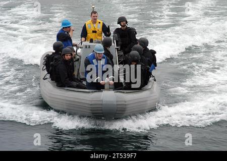 A U.S. Navy boarding team practices tactical movements aboard the USS ...