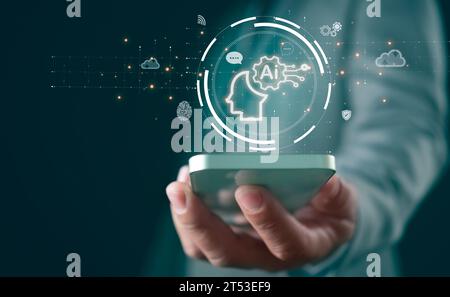 Businessman holds smartphone and shows AI brain. Shows AI brain network in business analytics, symbol, machine learning, artificial intelligence of fu Stock Photo