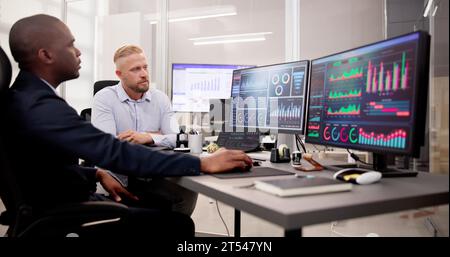 African American Data Analyst Using Data Analytics KPI Dashboard Stock Photo