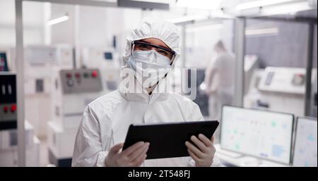 Pharmaceutical Industry Manufacturing Factory. Medical Engineer Using Technology Stock Photo