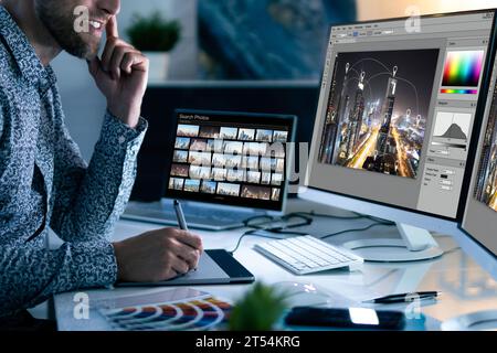 Graphic Designer at Work: Web Design, Computer Illuminate Nighttime Stock Photo