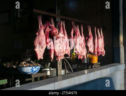 Goat meat hanging on a Goat Satay restaurant (Warung Sate Kambing), in Yogyakarta, Indonesia. Stock Photo