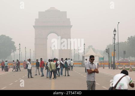 Thai Women Travel And Posing Take Photo India Gate Originally Called The  All India War Memorial At City Of Delhi With Indian People On March 17,  2019 In New Delhi, India Stock