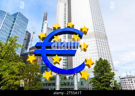 The Euro-Skulptur is a large Euro sign set up in front of the Eurotower in Frankfurt, Germany, former seat of the European Central Bank (ECB). Stock Photo