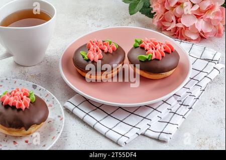 chocolate cake decorated with cream flowers Stock Photo