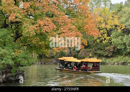 Beijing, China. 3rd Nov, 2023. Tourists enjoy the beauty of red leaves by boat at the Summer Palace in Beijing, capital of China, on Nov. 3, 2023. Credit: Yin Dongxun/Xinhua/Alamy Live News Stock Photo