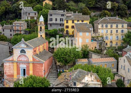 Nonza, perched village on Cap Corse. The historic village of Nonza, on the west coast of Cap Corse, is perched on the rock of U Monte and has a year-r Stock Photo