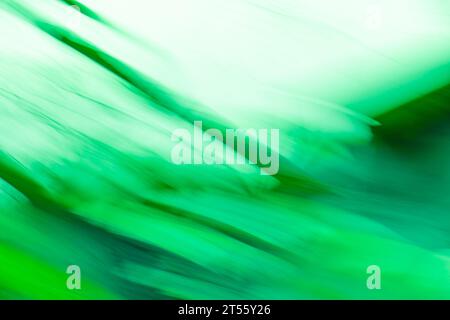 Long time exposure motion green blur. Fast speedy motion blur green background. Stock Photo