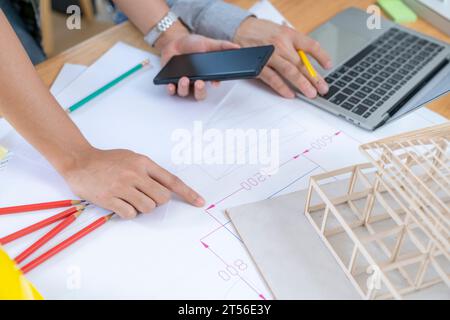 Female architect hands making model house, Construction concept of Engineer or architect meeting Stock Photo