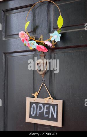 Open Sign Hangs on Door Stock Photo